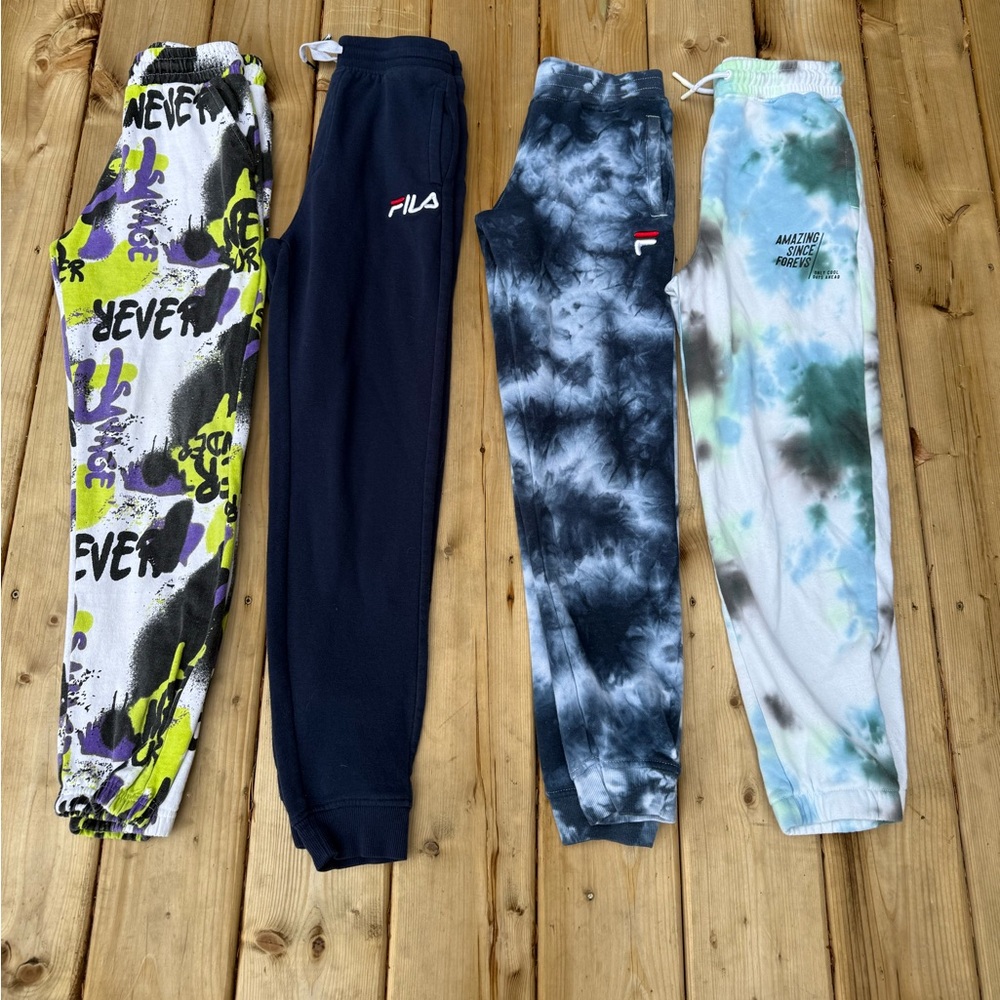 4 pairs of kids joggers. Fits like kids large (11-12)